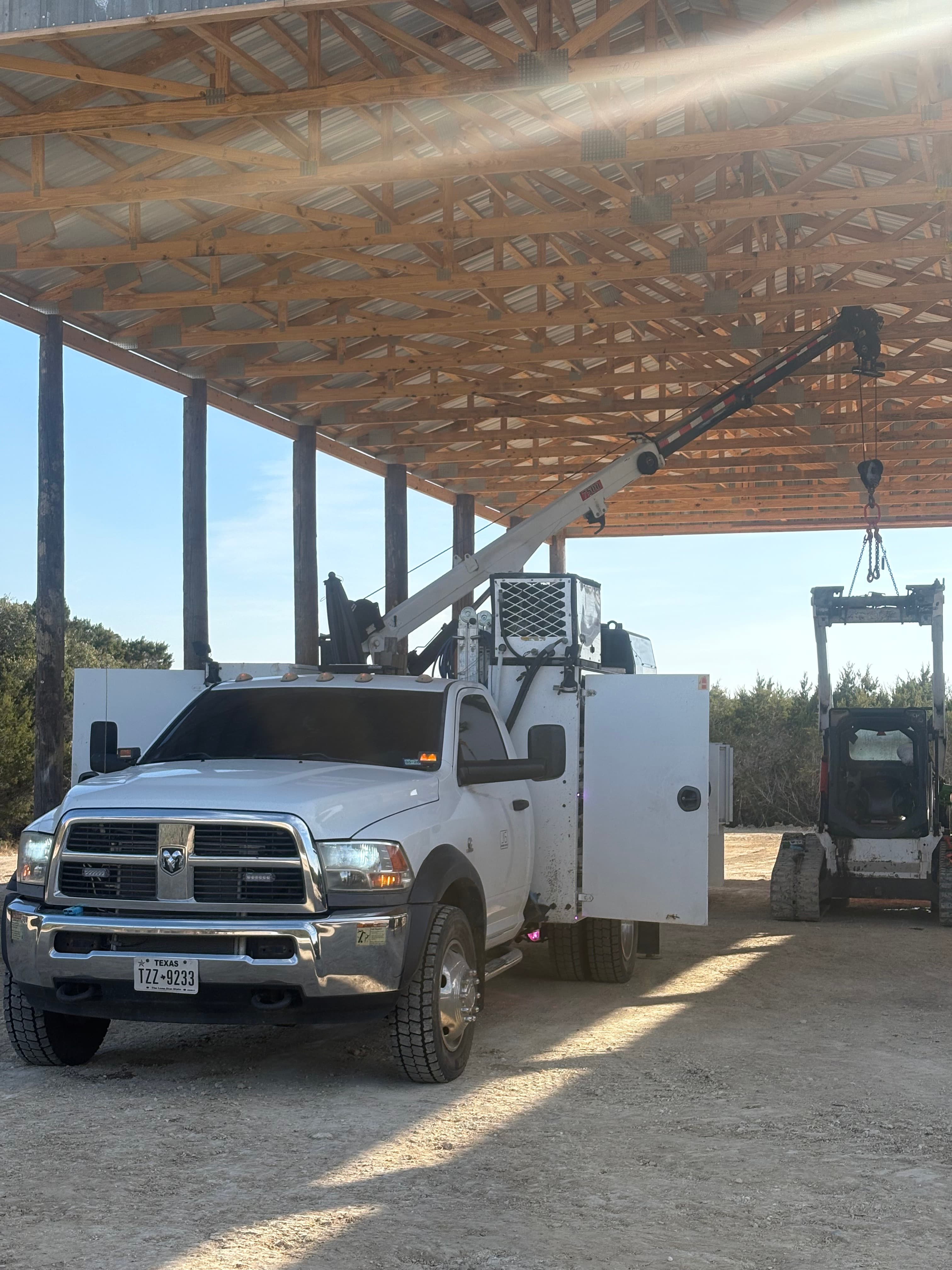 Jon's service truck parked under a barn awning