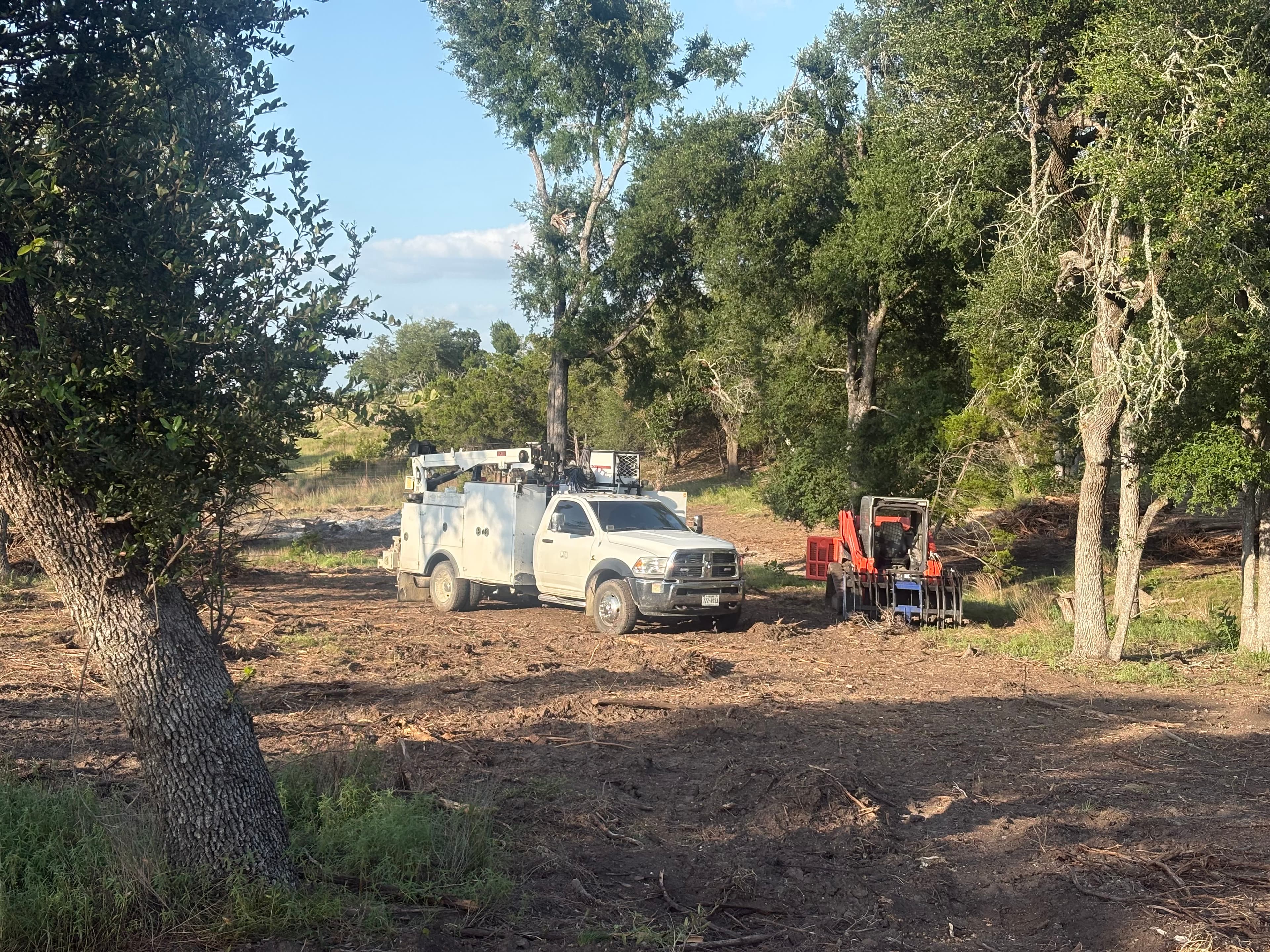 Jon's service truck parked on a Texas ranch with equipment in background